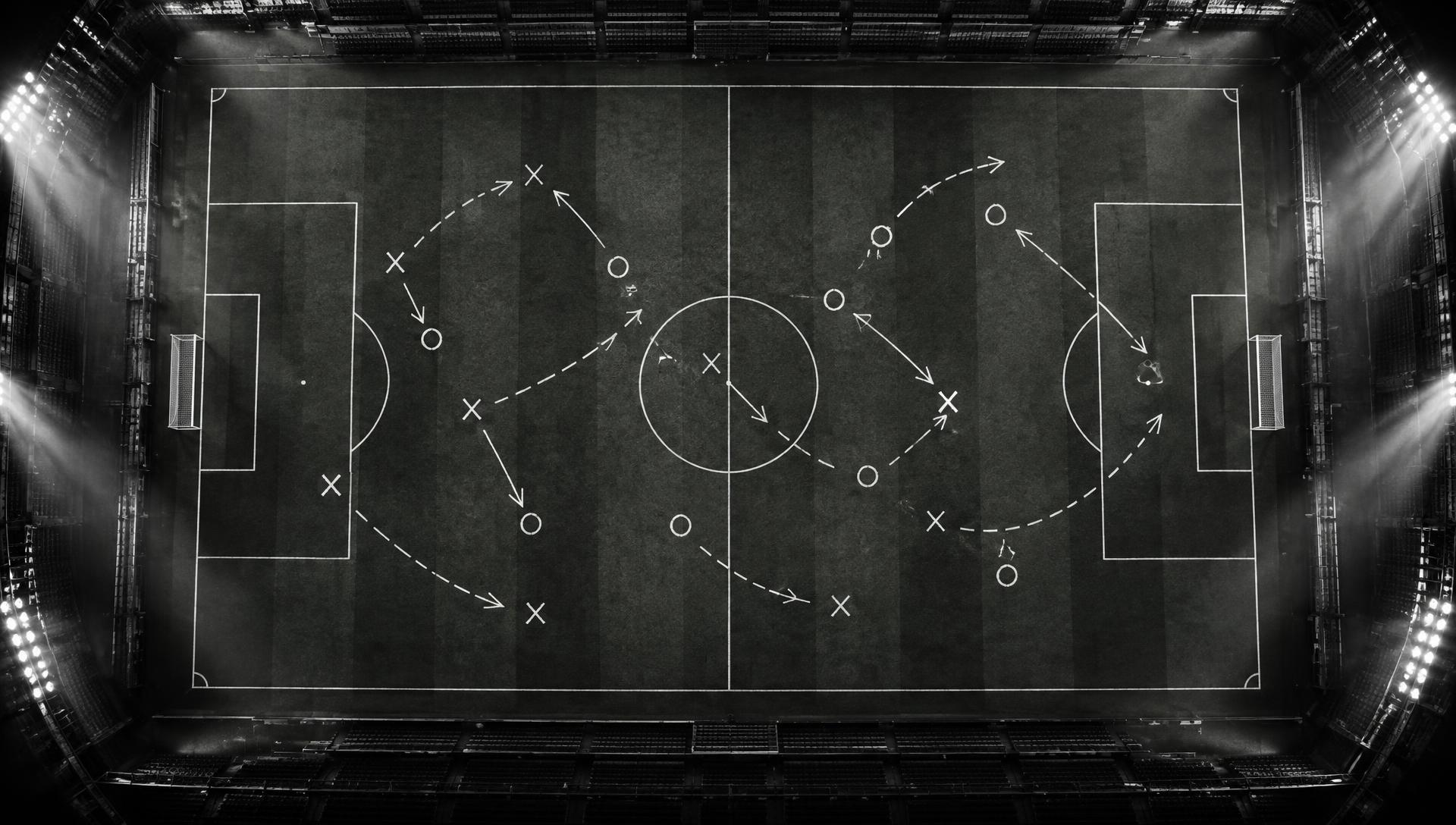 Football tactics board beside the pitch